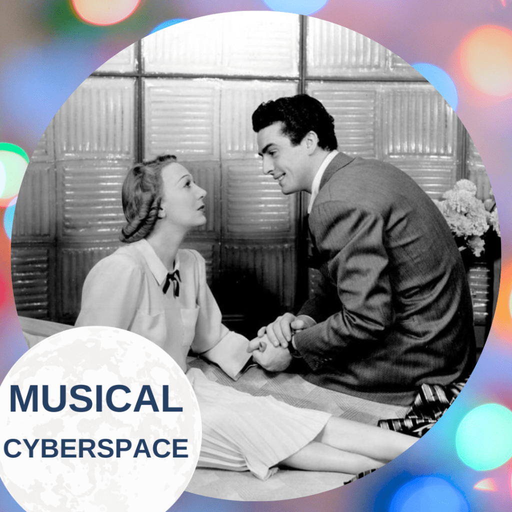Gertrude Lawrence, seated in a modest blouse and skirt, gazes with concern at Victor Mature (as Kendall Nesbitt), who leans in closely and holds her hand. The setting suggests an intimate, emotionally charged office conversation in LADY IN THE DARK. Presented in a stylized circular frame with “Musical Cyberspace” branding.