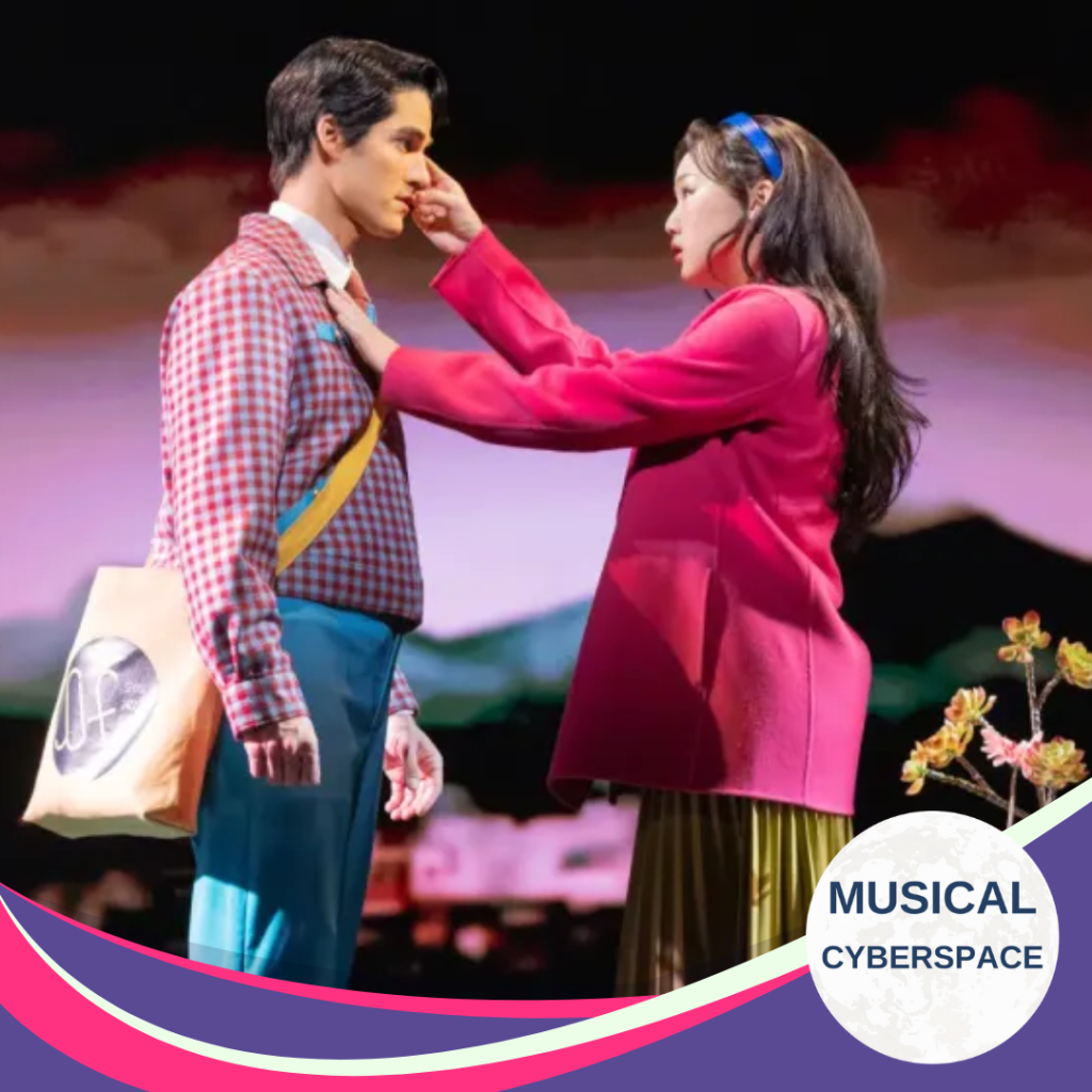 In a scene from the musical MAYBE HAPPY ENDING, Claire gently touches Oliver's face as her stands stiffly in front of her. Hes is dressed in a checkered shirt, blue trousers and a shoulder bag, while she wears a bright pink coat and a headband, gazing at him with concern. The background is softly lit in pastel tones with a stylized landscape and blossoms, evoking a sense of quiet intimacy and emotional awakening. A curved banner in pink, purple, and white at the bottom corner reads “Musical Cyberspace.”